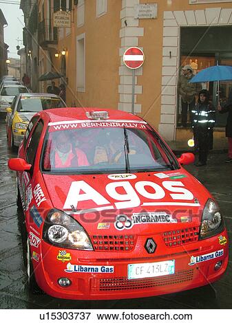 rally car, Italy, Montalcino, Toscana, Tuscany, Europe, The starting line up of the Trofeo Rally Coppa Liburna car race through the narrow streets of the medieval town of Montalcino on a rainy day. View Large Photo Image Stock Photo - rally car, Italy, Montalcino, Toscana, Tuscany, Europe, The starting line up of the Trofeo Rally Coppa Liburna car race through the narrow streets of the medieval town of Montalcino on a rainy day.. Fotosearch
