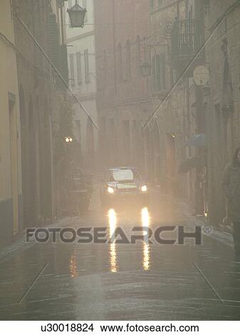 rally car, Tuscany, Italy, Montalcino, Toscana, Europe, Trofeo Rally Coppa Liburna car race through the narrow streets of the medieval town of Montalcino on a rainy day. View Large Photo Image Picture - rally car, Tuscany, Italy, Montalcino, Toscana, Europe, Trofeo Rally Coppa Liburna car race through the narrow streets of the medieval town of Montalcino on a rainy day.. Fotosearch
