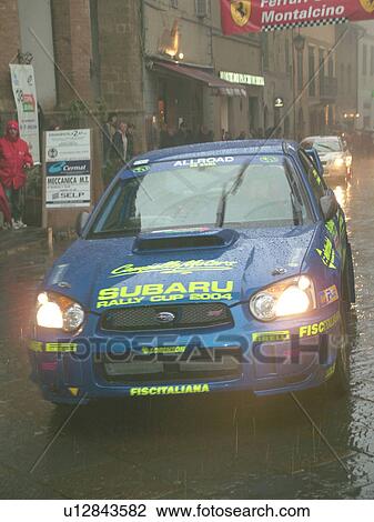 rally car, Tuscany, Italy, Montalcino, Toscana, Europe, The starting line of the Trofeo Rally Coppa Liburna car race through the narrow streets of the medieval town of Montalcino on a rainy day. View Large Photo Image Stock Image - rally car, Tuscany, Italy, Montalcino, Toscana, Europe, The starting line of the Trofeo Rally Coppa Liburna car race through the narrow streets of the medieval town of Montalcino on a rainy day.. Fotosearch