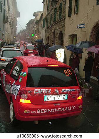 rally car, Tuscany, Italy, Montalcino, Toscana, Europe, The starting line up of the Trofeo Rally Coppa Liburna car race through the narrow streets of the medieval town of Montalcino on a rainy day. View Large Photo Image Stock Photography - rally car, Tuscany, Italy, Montalcino, Toscana, Europe, The starting line up of the Trofeo Rally Coppa Liburna car race through the narrow streets of the medieval town of Montalcino on a rainy day.. Fotosearch