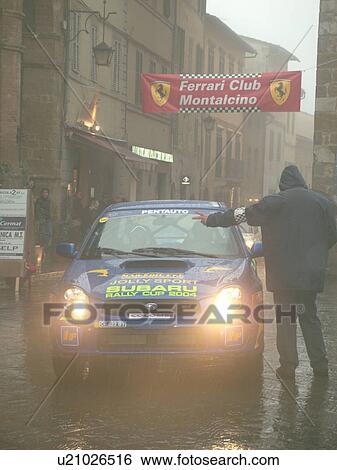 rally car, Tuscany, Toscana, Italy, Montalcino, Europe, The starting line of the Trofeo Rally Coppa Liburna car race through the narrow streets of the medieval town of Montalcino on a rainy day. View Large Photo Image Stock Photograph - rally car, Tuscany, Toscana, Italy, Montalcino, Europe, The starting line of the Trofeo Rally Coppa Liburna car race through the narrow streets of the medieval town of Montalcino on a rainy day.. Fotosearch