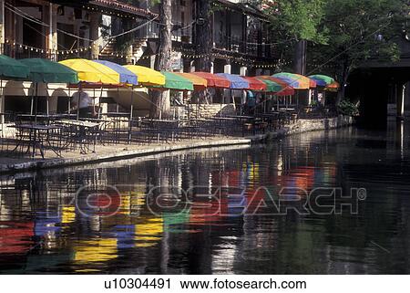 Stock Image -  San Antonio, TX, Texas, Paseo Del Rio, The Riverwalk, colorful umbrellas at outdoor cafT. Fotosearch