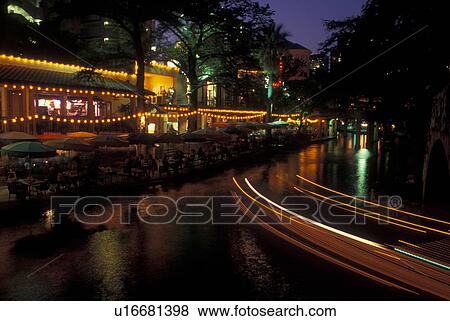Stock Photo -  San Antonio, TX, Texas, Paseo Del Rio, The Riverwalk, evening, cafTs. Fotosearch