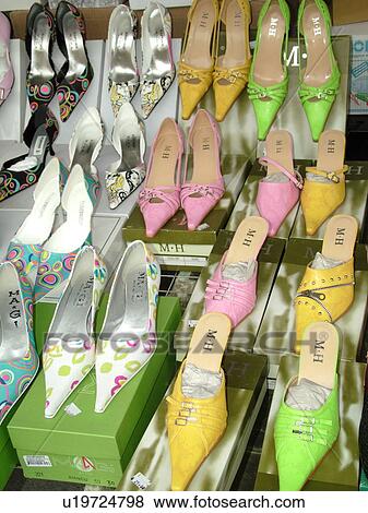Stock Photo -  shoes, Italy, Tuscany, Montalcino, Toscana, Europe, Pointed stylish women's' shoes on display at the outdoor market in the town of Montalcino.. Fotosearch