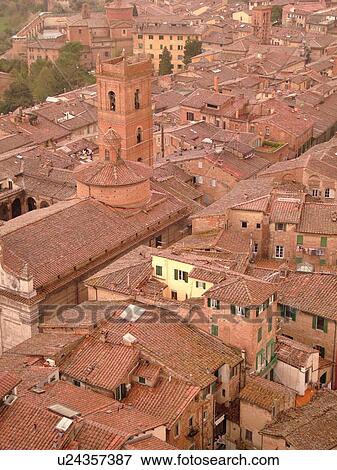Stock Photo -  Siena, Tuscany, Italy, Toscana, Europe, Aerial view of the rooftops and city of Siena from The Torre del Mangia.. Fotosearch