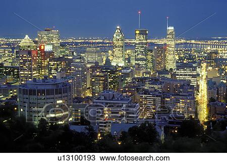 Stock Image -  skyline, Montreal, Canada, Quebec, Aerial view of downtown Montreal from Parc Mont Royal in the evening.. Fotosearch