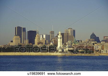 Stock Image -  skyline, Montreal, Canada, Quebec, Skyline of downtown Montreal along the St. Lawrence River (Fleuve Saint-Laurent).. Fotosearch