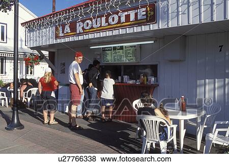 Stock Photo -  snack bar, Canada, Quebec, Laurentians, Saint-Jovite, Outdoor cafT in downtown Saint-Jovite.. Fotosearch
