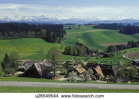 Picture -  Switzerland, Emmental, Bern, Affoltern, Europe, Farms in Affoltern in the scenic countryside of the Emmental Region in the spring in the Canton of Bern. . Fotosearch