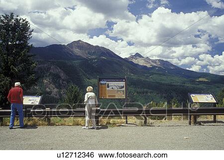 Stock Photograph -  Telluride, CO, Colorado, San Juan Mountains, San Juan National Forest, Elderly couple at overlook along the San Juan Skyway. Fotosearch