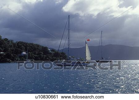 Stock Image -  Tortola, British Virgin Islands, Caribbean, West End, Sopers Hole, BVI, Boats buoyed at Sopers Hole at Frenchman's Cay on the island of Tortola.. Fotosearch