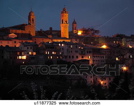 Stock Photography -  Toscana, Tuscany, Italy, Montalcino, Europe, View of the medieval hilltown of Montalcino in Tuscany in the evening.. Fotosearch