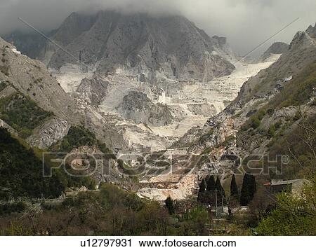 Stock Image -  Tuscany, Italy, Carrara, Toscana, Europe, Marble quarries on the mountainside of town of Carrara, the capital of white marble.. Fotosearch