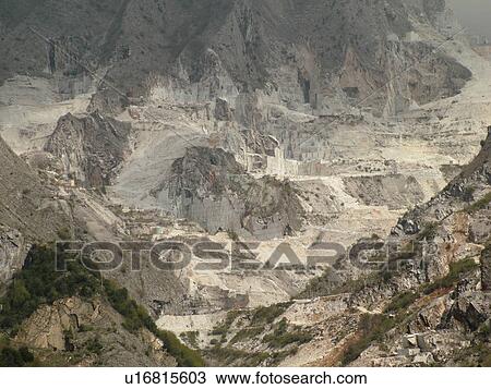 Stock Image -  Tuscany, Italy, Carrara, Toscana, Europe, Marble quarries on the mountainside of town of Carrara, the capital of white marble.. Fotosearch