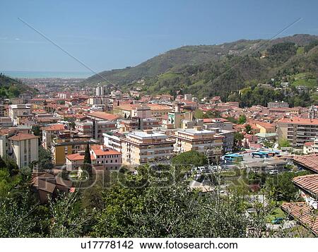 Stock Image -  Tuscany, Italy, Carrara, Toscana, Europe, Scenic view of the town of Carrara, capital of white marble.. Fotosearch