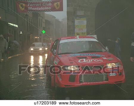 Tuscany, Italy, Montalcino, Toscana, Europe, The starting line of the Trofeo Rally Coppa Liburna car race through the narrow streets of the medieval town of Montalcino on a rainy day. View Large Photo Image Stock Photo - Tuscany, Italy, Montalcino, Toscana, Europe, The starting line of the Trofeo Rally Coppa Liburna car race through the narrow streets of the medieval town of Montalcino on a rainy day.. Fotosearch