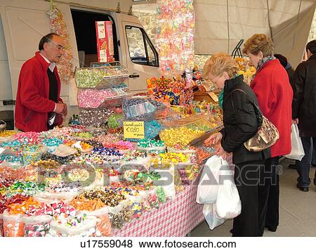 Stock Photo -  Tuscany, Italy, Montalcino, Toscana, Europe, Assorted candy for sale at the outdoor market in the town of Montalcino.. Fotosearch