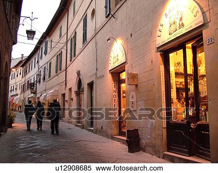 Tuscany, Italy, Montalcino, Toscana, Europe, Shops along a narrow street in the medieval hilltown of Montalcino in Tuscany. View Large Photo Image Stock Photography - Tuscany, Italy, Montalcino, Toscana, Europe, Shops along a narrow street in the medieval hilltown of Montalcino in Tuscany.. Fotosearch