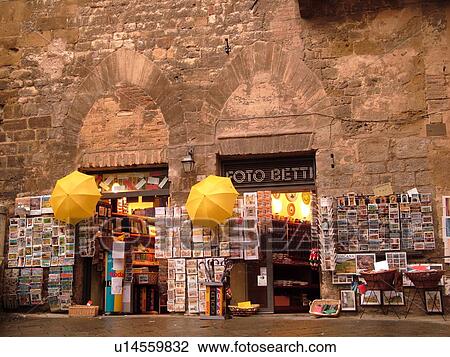 Tuscany, Italy, Siena, Toscana, Europe, Postcards and two yellow umbrellas displayed outside a local store in the city of Siena. View Large Photo Image Stock Image - Tuscany, Italy, Siena, Toscana, Europe, Postcards and two yellow umbrellas displayed outside a local store in the city of Siena.. Fotosearch
