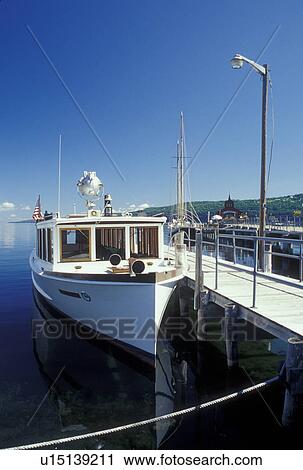 Stock Image -  Watkins Glen, NY, New York, Finger Lakes Region, Seneca Lake, public pier, tour boat. Fotosearch