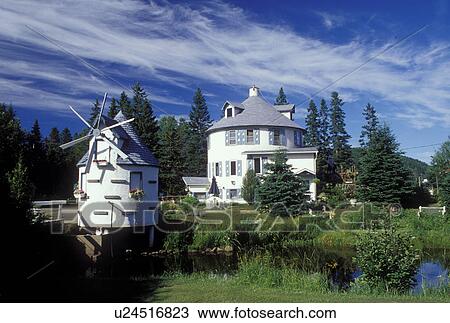 windmill, Canada, Quebec, Laurentians, Windmill decorates the lawn of a home in Val Morin. View Large Photo Image Stock Image - windmill, Canada, Quebec, Laurentians, Windmill decorates the lawn of a home in Val Morin.. Fotosearch