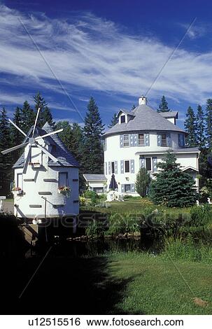 Stock Photograph -  windmill, Canada, Quebec, Laurentians, Windmill decorates the lawn of a home in Val Morin.. Fotosearch