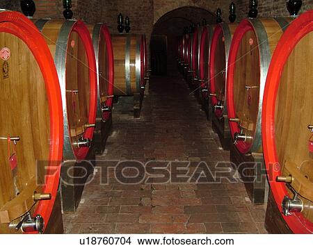 Picture -  wine barrels, Tuscany, Italy, Montepulciano, Toscana, Europe, Wine barrels in a wine cave in the town of Montepulciano.. Fotosearch