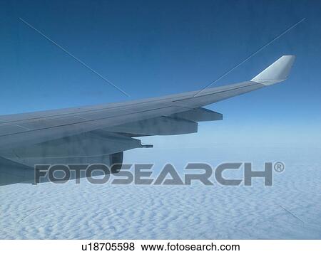wing of airplane over clouds View Large Photo Image Stock Photo - wing of airplane over clouds. Fotosearch