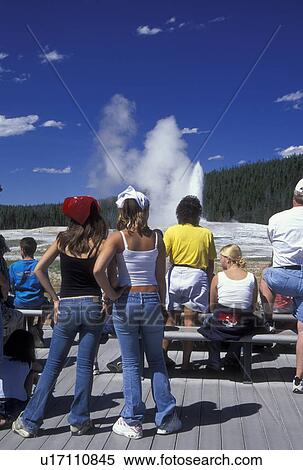 WY, Wyoming, Yellowstone National Park, Old Faithful Geyser, Upper Geyser Basin, Crowd of people watching Old Faithful erupting. View Large Photo Image Stock Photography - WY, Wyoming, Yellowstone National Park, Old Faithful Geyser, Upper Geyser Basin, Crowd of people watching Old Faithful erupting.. Fotosearch