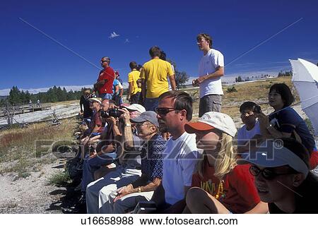 Yellowstone National Park, WY, Wyoming, Crowd of people watching Beehive Geyser, Upper Geyser Basin View Large Photo Image Stock Photo - Yellowstone National Park, WY, Wyoming, Crowd of people watching Beehive Geyser, Upper Geyser Basin. Fotosearch