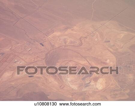 Stock Image -  Aerial, airplane flying over the Rockies. Fotosearch