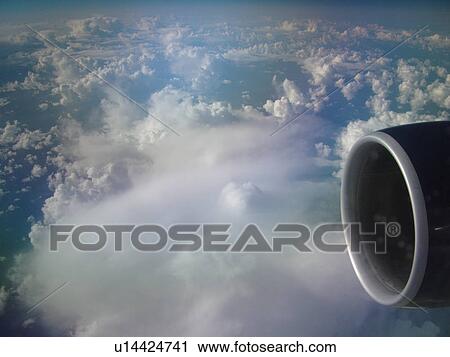 Aerial, airplane flying over the Pacific Ocean, clouds, View Large Photo Image Stock Image - Aerial, airplane flying over the Pacific Ocean, clouds, . Fotosearch