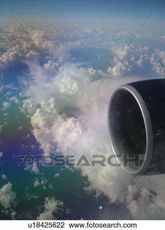 Stock Image -  Aerial, airplane flying over the Pacific Ocean, clouds, . Fotosearch