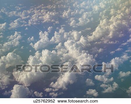 Aerial, airplane flying over the Pacific Ocean, clouds, View Large Photo Image Stock Image - Aerial, airplane flying over the Pacific Ocean, clouds, . Fotosearch