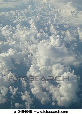 Aerial, airplane flying over the Pacific Ocean, clouds, View Large Photo Image Stock Photo - Aerial, airplane flying over the Pacific Ocean, clouds, . Fotosearch