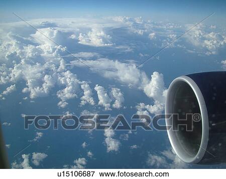Aerial, airplane flying over the Pacific Ocean, clouds, View Large Photo Image Stock Photo - Aerial, airplane flying over the Pacific Ocean, clouds, . Fotosearch