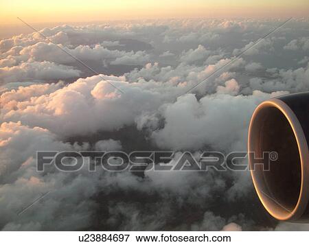 Aerial, airplane flying over the Pacific Ocean, clouds, View Large Photo Image Stock Photo - Aerial, airplane flying over the Pacific Ocean, clouds, . Fotosearch