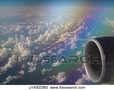 Stock Photography -  Aerial, airplane flying over the Pacific Ocean, clouds, . Fotosearch