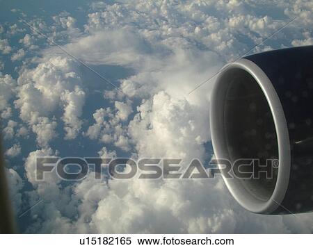 Stock Photography -  Aerial, airplane flying over the Pacific Ocean, clouds, . Fotosearch