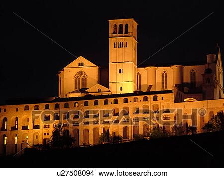 Assisi, Italy, Umbria, Europe, Basilica di San Francesco (Basilica of St. Francis of Assisi) and the Sacro Convento illuminated at night on the slopes of Monte Subasio in the medieval hill town of Assisi. View Large Photo Image Picture - Assisi, Italy, Umbria, Europe, Basilica di San Francesco (Basilica of St. Francis of Assisi) and the Sacro Convento illuminated at night on the slopes of Monte Subasio in the medieval hill town of Assisi.. Fotosearch