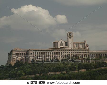 Assisi, Italy, Umbria, Europe, Basilica di San Francesco (Basilica of St. Francis of Assisi) and the Sacro Convento on the slopes of Monte Subasio in the medieval hill town of Assisi. View Large Photo Image Stock Photo - Assisi, Italy, Umbria, Europe, Basilica di San Francesco (Basilica of St. Francis of Assisi) and the Sacro Convento on the slopes of Monte Subasio in the medieval hill town of Assisi.. Fotosearch