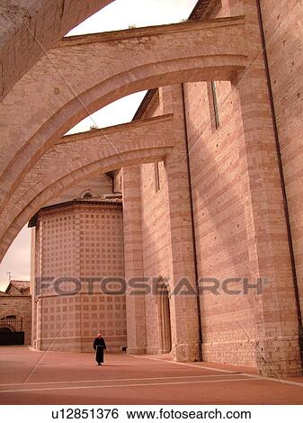 Stock Photograph -  Assisi, Italy, Umbria, Europe, Buttresses on the Basilica di Santa Chiara in the medieval hill town of Assisi.. Fotosearch