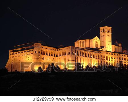 Assisi, Umbria, Italy, Europe, Basilica di San Francesco (Basilica of St. Francis of Assisi) and the Sacro Convento illuminated at night on the slopes of Monte Subasio in the medieval hill town of Assisi. View Large Photo Image Stock Photo - Assisi, Umbria, Italy, Europe, Basilica di San Francesco (Basilica of St. Francis of Assisi) and the Sacro Convento illuminated at night on the slopes of Monte Subasio in the medieval hill town of Assisi.. Fotosearch