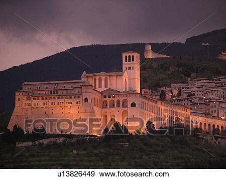 Assisi, Umbria, Italy, Europe, Basilica di San Francesco (Basilica of St. Francis of Assisi) and the Sacro Convento illuminated at night on the slopes of Monte Subasio in the medieval hill town of Assisi. View Large Photo Image Stock Photo - Assisi, Umbria, Italy, Europe, Basilica di San Francesco (Basilica of St. Francis of Assisi) and the Sacro Convento illuminated at night on the slopes of Monte Subasio in the medieval hill town of Assisi.. Fotosearch
