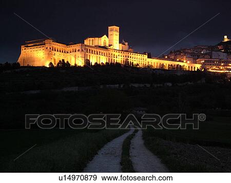 Assisi, Umbria, Italy, Europe, Basilica di San Francesco (Basilica of St. Francis of Assisi) and the Sacro Convento illuminated at night on the slopes of Monte Subasio in the medieval hill town of Assisi. View Large Photo Image Stock Photo - Assisi, Umbria, Italy, Europe, Basilica di San Francesco (Basilica of St. Francis of Assisi) and the Sacro Convento illuminated at night on the slopes of Monte Subasio in the medieval hill town of Assisi.. Fotosearch