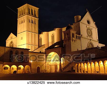 Assisi, Umbria, Italy, Europe, Basilica di San Francesco (Basilica of St. Francis of Assisi) and the Sacro Convento illuminated at night in the Piazza inf. re di San Francesco in the medieval hill town of Assisi. View Large Photo Image Stock Photography - Assisi, Umbria, Italy, Europe, Basilica di San Francesco (Basilica of St. Francis of Assisi) and the Sacro Convento illuminated at night in the Piazza inf. re di San Francesco in the medieval hill town of Assisi.. Fotosearch