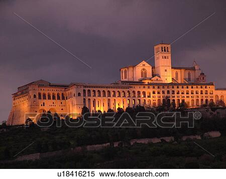 Assisi, Umbria, Italy, Europe, Basilica di San Francesco (Basilica of St. Francis of Assisi) and the Sacro Convento illuminated at night on the slopes of Monte Subasio in the medieval hill town of Assisi. View Large Photo Image Stock Photography - Assisi, Umbria, Italy, Europe, Basilica di San Francesco (Basilica of St. Francis of Assisi) and the Sacro Convento illuminated at night on the slopes of Monte Subasio in the medieval hill town of Assisi.. Fotosearch