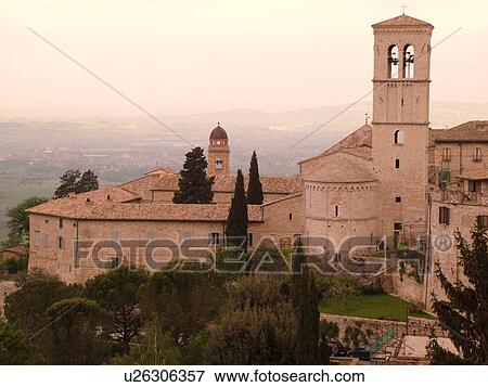 Assisi, Umbria, Italy, Europe, View of Chiesa Santa Maria Maggiore from Piazza Santa Chiara in the medieval hill town of Assisi. View Large Photo Image Stock Photo - Assisi, Umbria, Italy, Europe, View of Chiesa Santa Maria Maggiore from Piazza Santa Chiara in the medieval hill town of Assisi.. Fotosearch