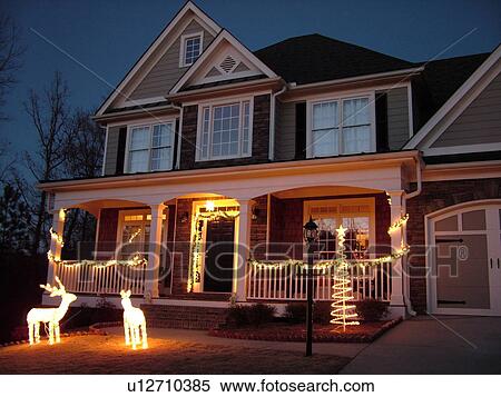 Stock Photography -  Atlanta, GA, Georgia, house, Christmas decorations, evening. Fotosearch