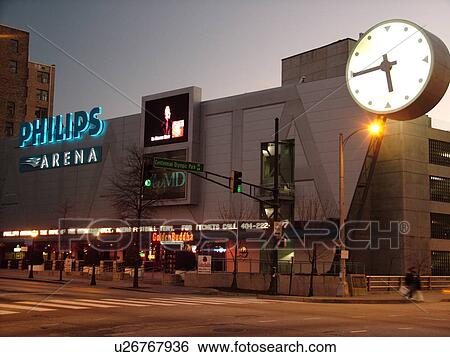 Stock Photograph -  Atlanta, GA, Georgia, Philips Arena, large illuminated clock, evening. Fotosearch